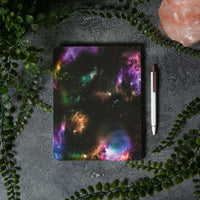 Beautifica 7x9" softback journal, showing back view of galaxy print on black background.